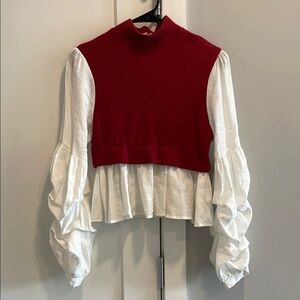 Cropped Red Knit Vest Over White Ruffled Blouse